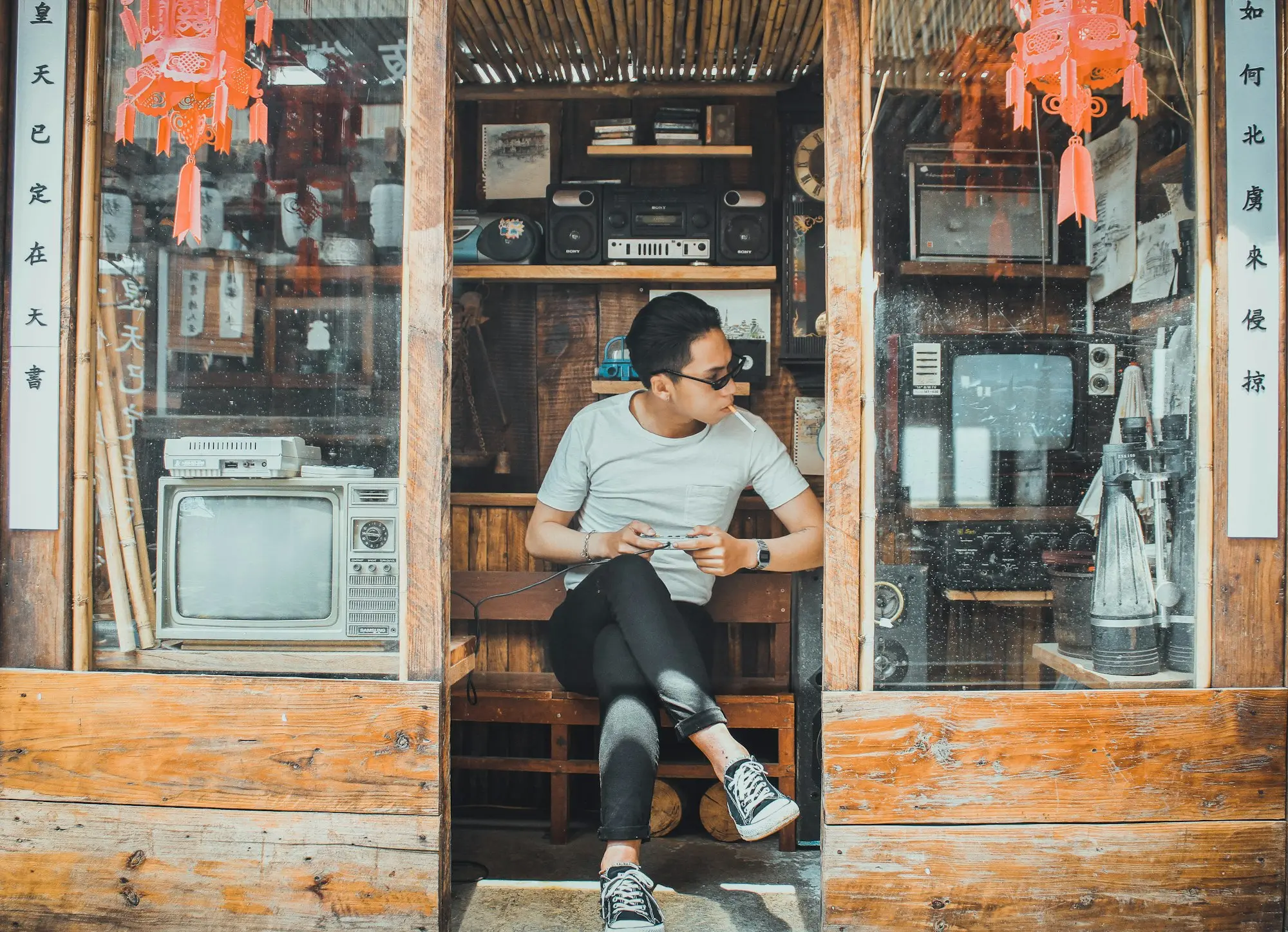 Owner sitting in the doorway of a newly opened shopfront
