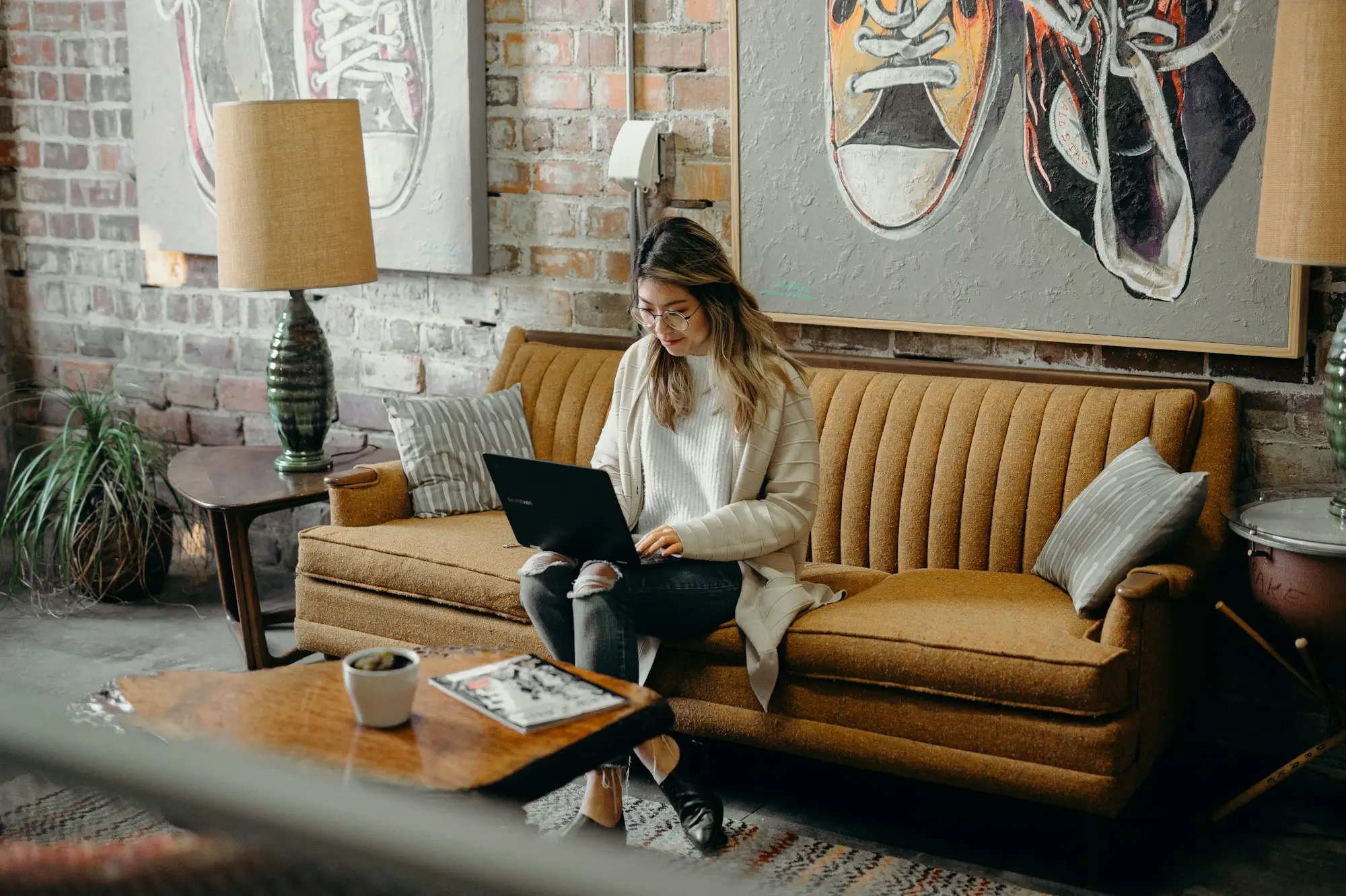 Business owner working on a laptop from the lounge at home